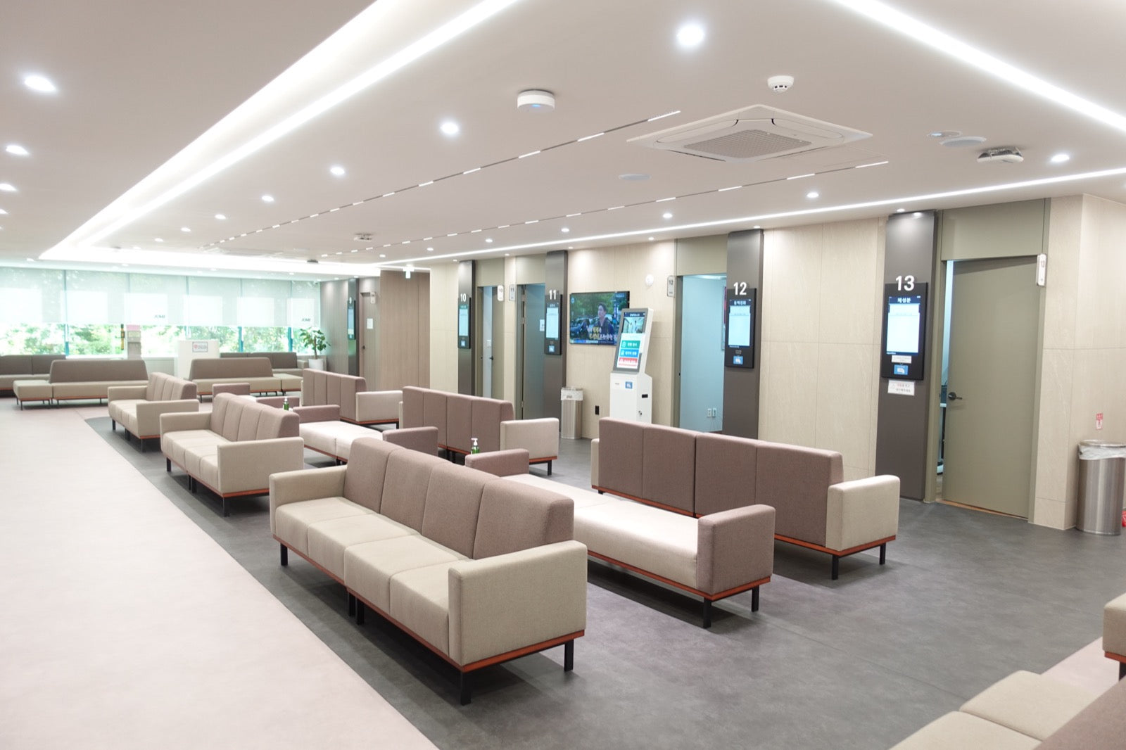 KMI waiting lounge with self check-in kiosks